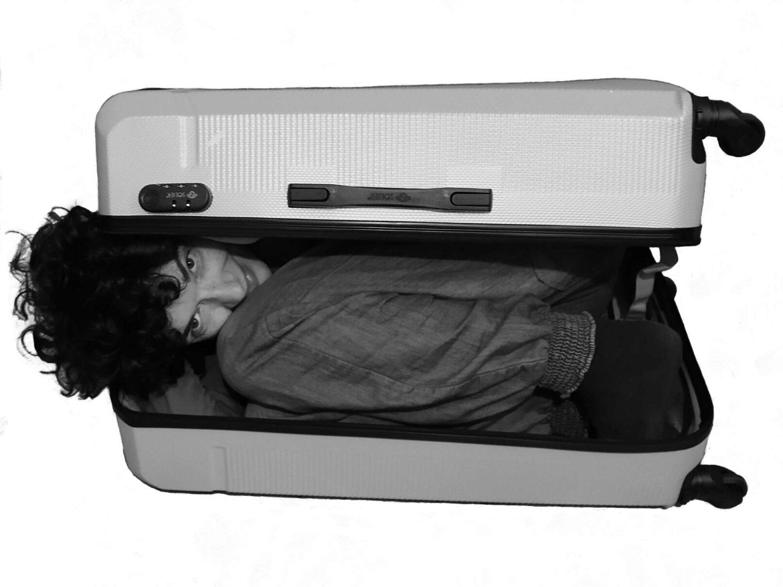 Person inside a luggage work by Marta Kawecka, Untitled, 2024